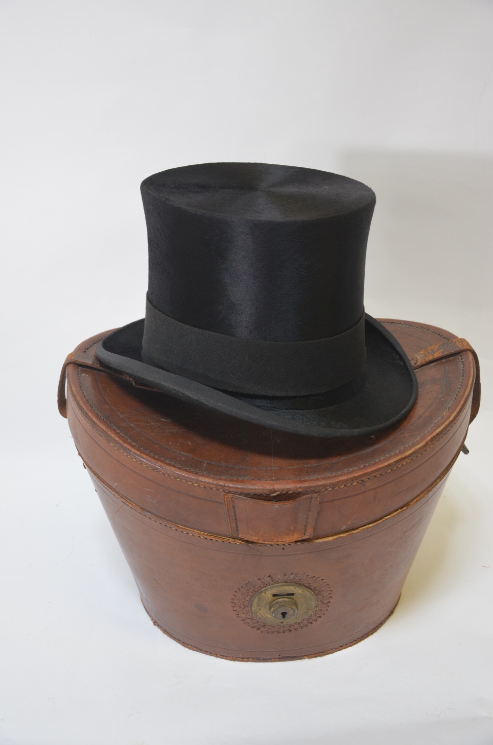 A vintage black silk top hat retailed by Andre & Co. Ltd. Hatters, 163 Piccadilly, W.