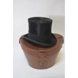 A vintage black silk top hat retailed by Andre & Co. Ltd. Hatters, 163 Piccadilly, W.