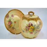 A Royal Worcester blush ground lobed jar, cover and stand, decorated with flowers and foliage,