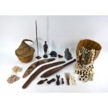 A mixed selection of ethnographia, including Moses Align Inuit stone sculpture of a fisherman,