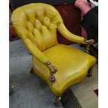 A Victorian walnut framed open armchair with later deep-buttoned leather upholstery