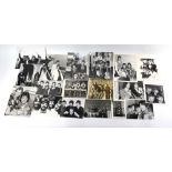 The Beatles: A collection of twelve 1960s 10" x 8" Press Agency photographs,