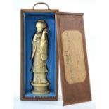 A Chinese ivory carving of a standing Manchu/Chinese women,