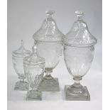 A pair of 19th century half-fluted covered urns,