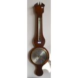 A 19th century mahogany wheel barometer with silvered thermometer scale and 20 cm main dial by