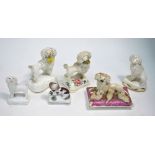 A small collection of 19th century Staffordshire poodle models including a rectangular lid with a