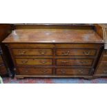An 18th century mahogany cross-banded oak mule chest having two dummy drawer fronts over four