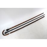 An Edwardian silver-mounted thorn walking-stick to/w a twist-carved walking cane with ebonised