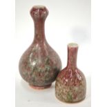 Two mottled langyao style vases with green inclusions: one of garlic mouth form with oviform body,
