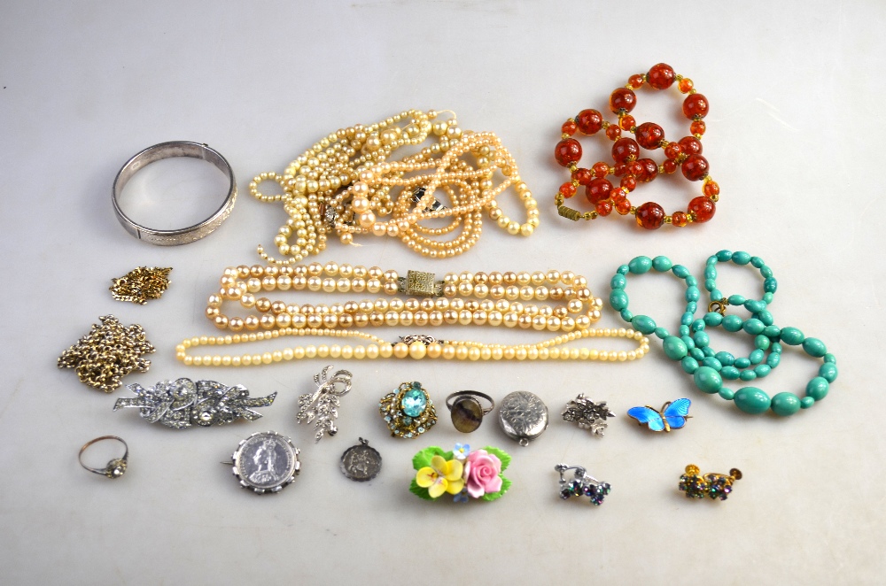 A collection of vintage jewellery including seven rows of simulated pearls, glass bead necklaces,