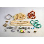 A collection of vintage jewellery including seven rows of simulated pearls, glass bead necklaces,