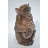 A Royal Copenhagen porcelain model of a seated monkey, no.