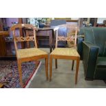 A pair of Swedish satin walnut & burr parlour chairs with foliate carved back rails and caned seats