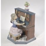 Lladro figural group - Girl playing a piano, no .