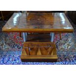 An Art Deco period figured walnut folding supper/hall table raised on four chrome pillars,