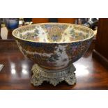 A Satsuma-style bowl decorated with floral designs; 35cm diameter,