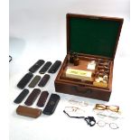 A selection of optician's glass and other instruments and accessories,