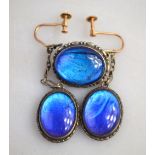A pair of oval drop earrings, set with butterfly wing feathers, to/w matching brooch,