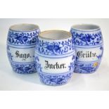 Three 19th century German kitchen/herb jars, underglaze blue floral and foliate decoration,