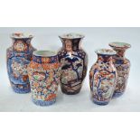 Five Japanese Imari vases, variously decorated with typical designs of karako, panels of pine,