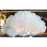 A white ostrich-feather fan on mother-of-pearl sticks,
