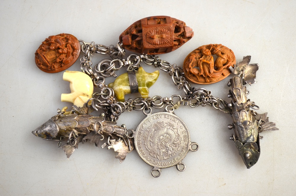 Lot containing various jewellery items including charm bracelet with carved charms and articulated - Image 2 of 3