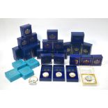 A collection of twenty-seven Halcyon Days enamel boxes, including Mothers' Day, St.