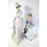 A Lladro figure of a lady holding an unclosed parasol, 39 cm high,