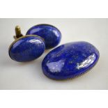 A large oval lapis lazuli brooch to/w a pair of large oval lapis cufflinks,