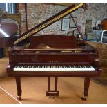 A Yamaha G2 model baby grand piano in a bright mahogany case, frame number J3750025 (dated 1983),