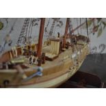 A wooden model of a two-masted schooner, Le Hussard,