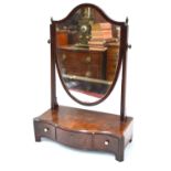 A 19th century mahogany shield shaped toilet mirror on a three drawer serpentine base,