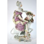 A rare 18th century Derby figural group of Europa and the Bull, raised on a scrolling base,
