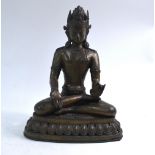 A metal figure of a Bodhisattva, possibly Maitreya the Buddha of the future,