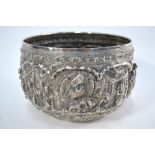 A Burmese silver bowl with elephant decorated base,