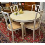 An Italian cream painted extending dining table and four chairs to match lots 1263 & 1266