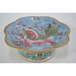 A famille rose foliate dish, decorated with a playful Buddhist Lion,