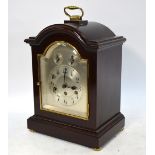 A continental stained walnut cased 8-day mantel clock,