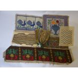 A collection of over twenty wool-worked tapestry panels including a finely worked petit-point pouch