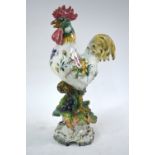 A GBV Nove Italian faience model of a cockerel, his body painted with floral sprays,