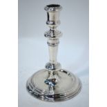 A single George I cast Britannia Standard baluster candlestick with dished circular base,
