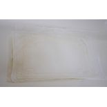 A set of eight drawn-threadwork linen napkins, seven matching placemats,