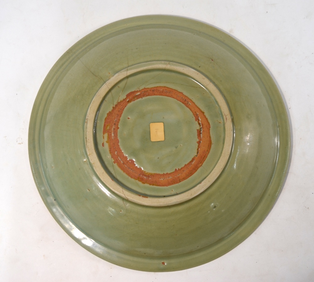 A Ming celadon dish of circular form, decorated at the centre with a floral spray, - Image 6 of 6