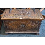 A carved oak blanket box with galleon top,