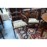A set of six Regency mahogany dining chairs with shaped and moulded splats, fabric seat pads,