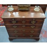 An 18th century mahogany chest of four long graduated drawers beneath a brush slide,