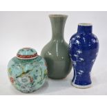 A blue and white vase with prunus design, 22 cm high; a celadon monochrome vase with oviform body,