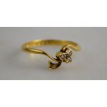 A diamond set crossover ring in form of clover, 18ct yellow gold,