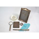 A Tiffany & Co sterling letter knife in original cloth slip, to/w an engine-turned cigarette case,