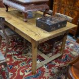 A 19th century French fruitwood refectory table wide plank top raised on chamfered legs united by a